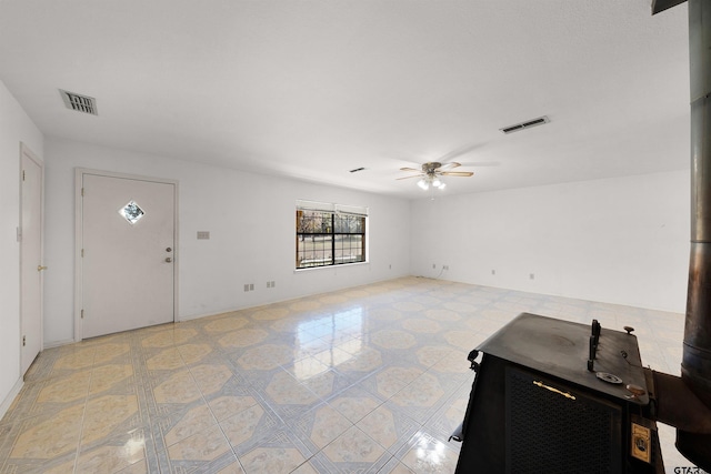 entrance foyer with ceiling fan