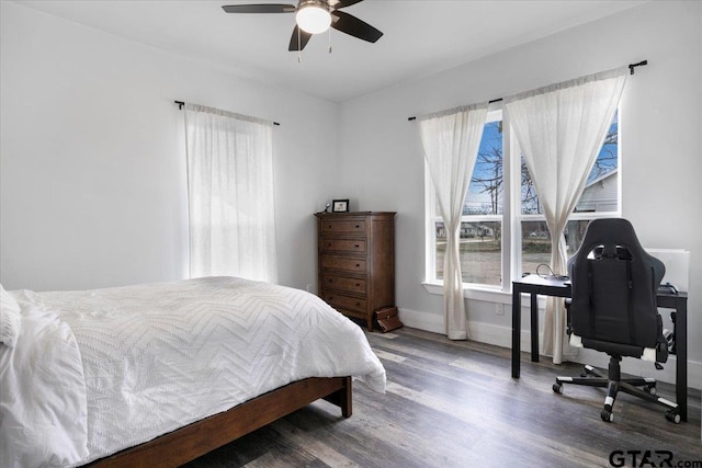 bedroom featuring wood-type flooring and ceiling fan