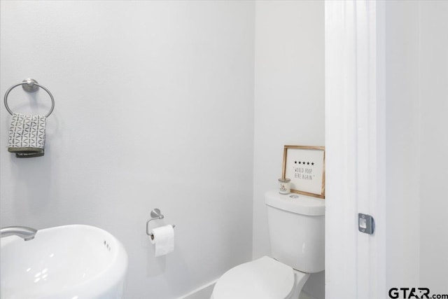 bathroom with sink and toilet