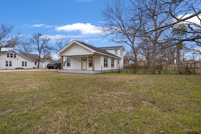 view of front facade featuring a front lawn and covered porch