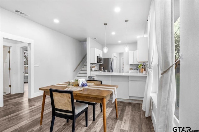 dining room featuring dark hardwood / wood-style flooring