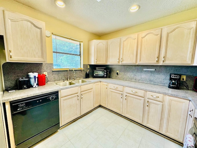 kitchen featuring black dishwasher, a textured ceiling, sink, backsplash, and light brown cabinetry