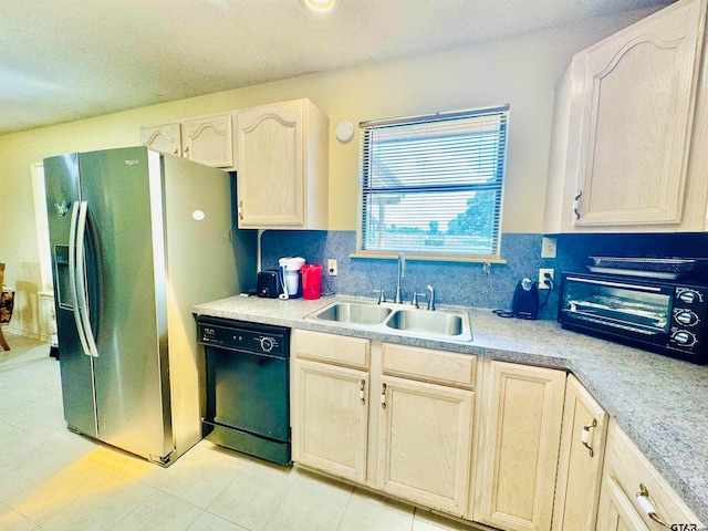 kitchen featuring dishwasher, light brown cabinetry, sink, and stainless steel fridge with ice dispenser