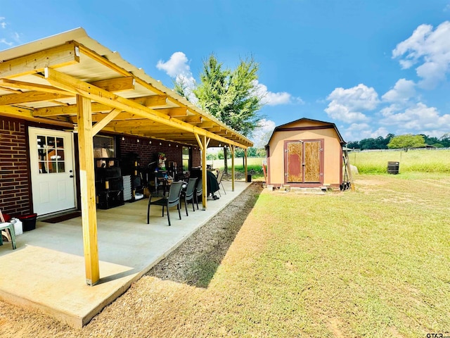 view of yard with a shed and a patio