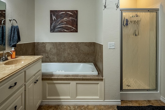 200 County Road 1520, Mount Pleasant, TX 75455 - bathroom featuring a shower stall, a textured wall, a bath, and vanity
