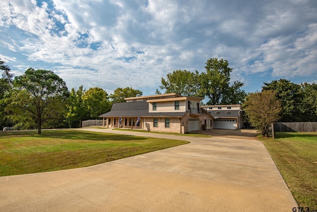 200 County Road 1520, Mount Pleasant, TX 75455 - traditional-style house featuring a front lawn, driveway, covered porch, fence, and a garage