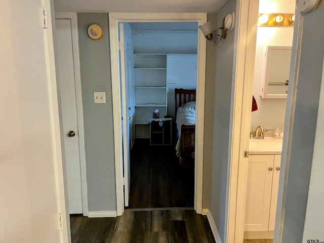 219 Lockhart St, Pittsburg, TX 75686 - corridor with dark wood-style floors and a sink