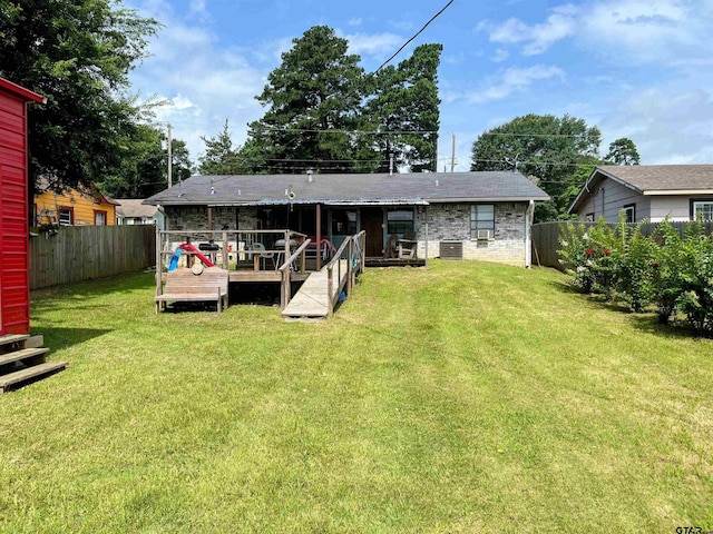 219 Lockhart St, Pittsburg, TX 75686 - rear view of property featuring a fenced backyard and a wooden deck