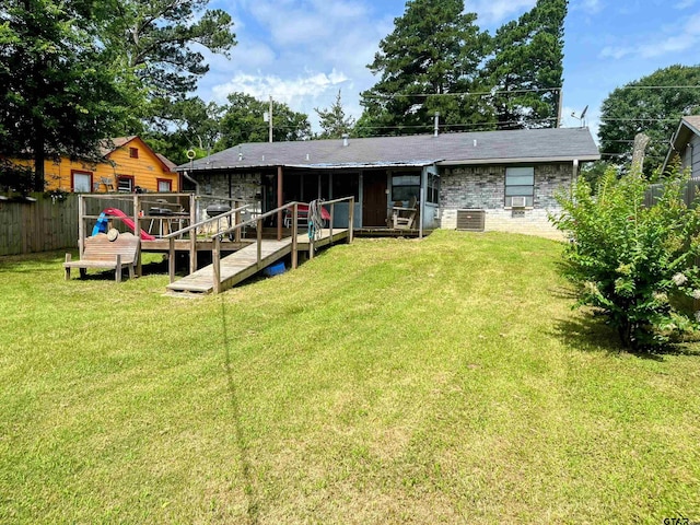 219 Lockhart St, Pittsburg, TX 75686 - rear view of house featuring a wooden deck