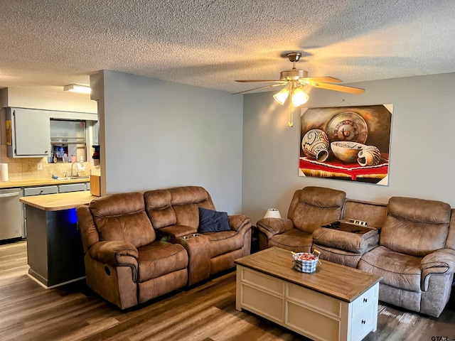 219 Lockhart St, Pittsburg, TX 75686 - living room with ceiling fan, dark wood-style flooring, and a textured ceiling