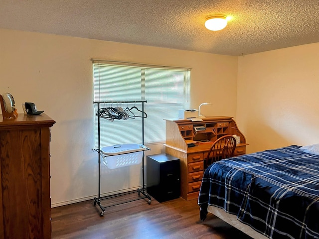 219 Lockhart St, Pittsburg, TX 75686 - bedroom with wood finished floors and a textured ceiling