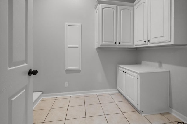 3827 Scenic Dr, Tyler, TX 75709 - laundry area featuring baseboards and light tile patterned floors