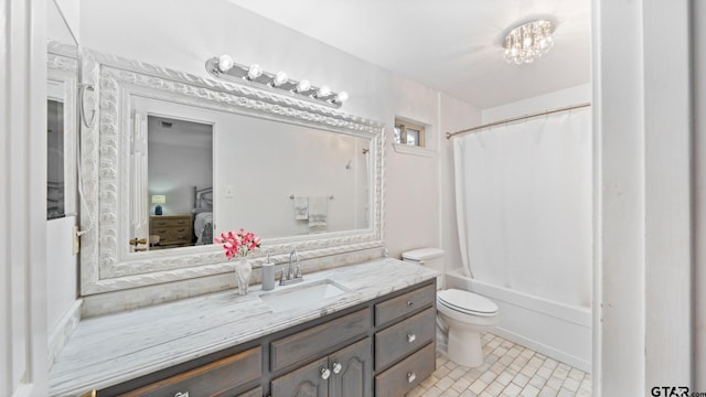 full bathroom with vanity, shower / bath combo with shower curtain, and toilet