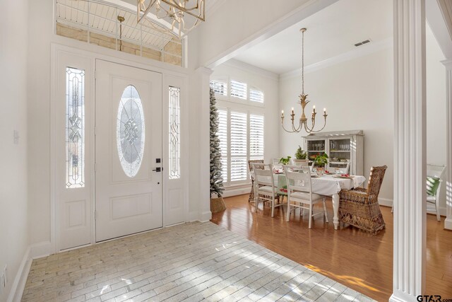 110 Carmel, Bullard, TX 75757 - foyer entrance with a chandelier, hardwood / wood-style flooring, healthy amount of natural light, crown molding, and a high ceiling