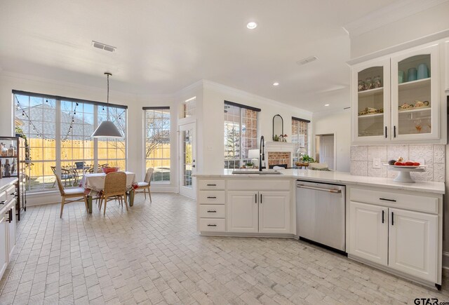 110 Carmel, Bullard, TX 75757 - kitchen featuring stainless steel dishwasher, a sink, crown molding, decorative backsplash, and glass insert cabinets