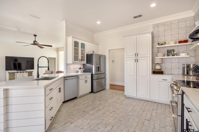 110 Carmel, Bullard, TX 75757 - kitchen with appliances with stainless steel finishes, a sink, a peninsula, decorative backsplash, and a ceiling fan