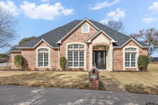 110 Carmel, Bullard, TX 75757 - french country inspired facade with brick siding, a front lawn, and roof with shingles