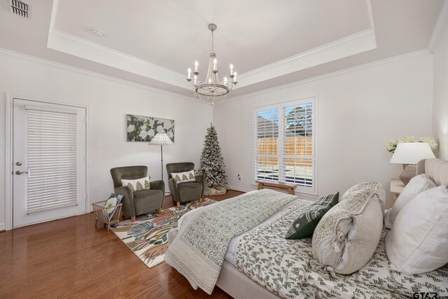 110 Carmel, Bullard, TX 75757 - bedroom featuring a tray ceiling, a chandelier, wood finished floors, and crown molding