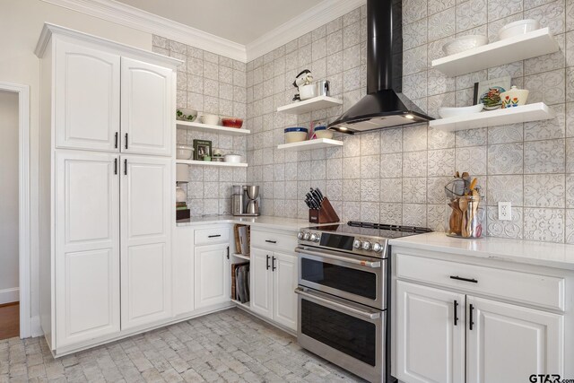 110 Carmel, Bullard, TX 75757 - kitchen with wall chimney exhaust hood, range with two ovens, open shelves, backsplash, and white cabinetry