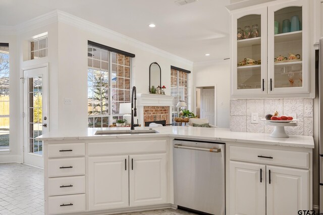 110 Carmel, Bullard, TX 75757 - kitchen with stainless steel dishwasher, a sink, ornamental molding, light stone countertops, and backsplash
