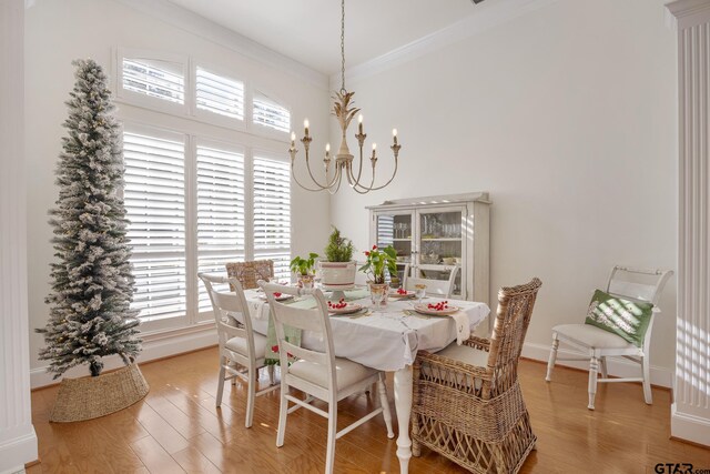 110 Carmel, Bullard, TX 75757 - dining room with crown molding, light wood-style flooring, a chandelier, baseboards, and a high ceiling
