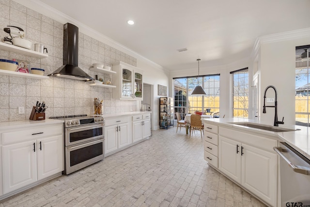 110 Carmel, Bullard, TX 75757 - kitchen with appliances with stainless steel finishes, wall chimney range hood, open shelves, a sink, and brick patterned flooring