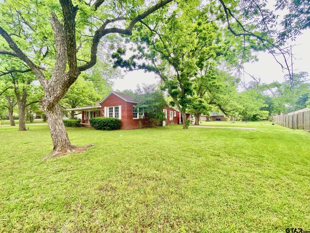 710 N 6th St, Crockett, TX 75835 - view of yard with fence