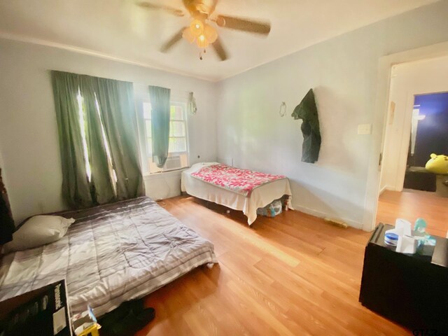 710 N 6th St, Crockett, TX 75835 - bedroom featuring a ceiling fan and wood finished floors