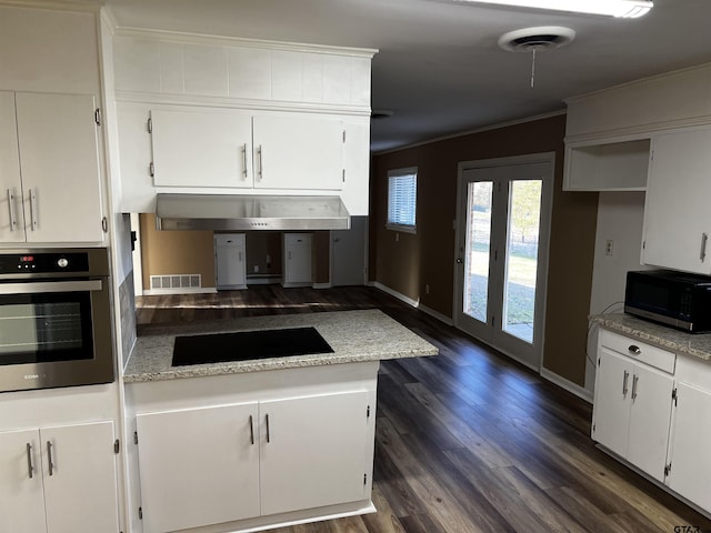 kitchen with visible vents, ornamental molding, white cabinetry, stainless steel oven, and black electric stovetop