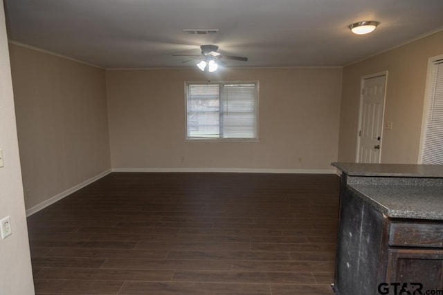700 E Main, Whitehouse, TX 75791 - unfurnished living room featuring a ceiling fan, crown molding, and dark wood finished floors