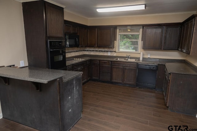 700 E Main, Whitehouse, TX 75791 - kitchen featuring black appliances, a peninsula, dark wood-style flooring, dark brown cabinets, and ornamental molding