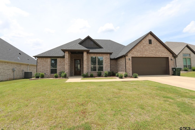 11747 Jayden Ln, Tyler, TX 75703 - view of front of house featuring brick siding, a garage, driveway, and a shingled roof
