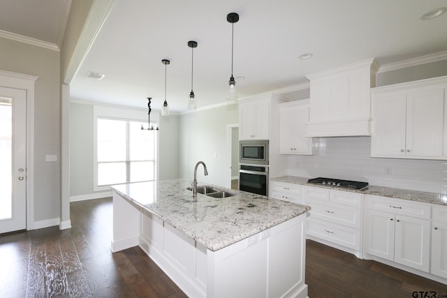 11747 Jayden Ln, Tyler, TX 75703 - kitchen featuring appliances with stainless steel finishes, decorative backsplash, dark wood finished floors, white cabinetry, and ornamental molding