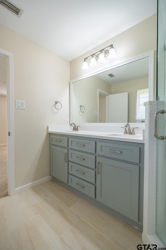 902 Joel Dr, Tyler, TX 75703 - bathroom featuring double vanity and a stall shower