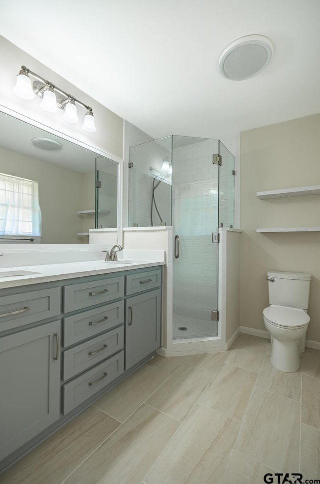 902 Joel Dr, Tyler, TX 75703 - full bath featuring double vanity, a stall shower, and toilet
