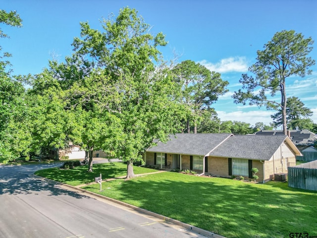 902 Joel Dr, Tyler, TX 75703 - view of front of house featuring brick siding and roof with shingles