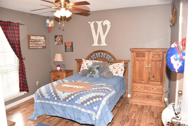 607 Brookhollow Dr, Palestine, TX 75801 - bedroom featuring light wood finished floors, baseboards, and a ceiling fan