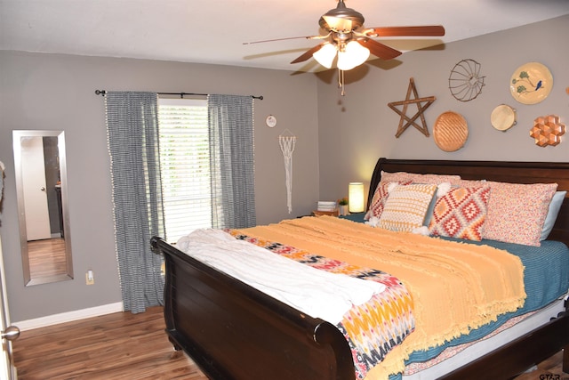 607 Brookhollow Dr, Palestine, TX 75801 - bedroom with baseboards, wood finished floors, and ceiling fan