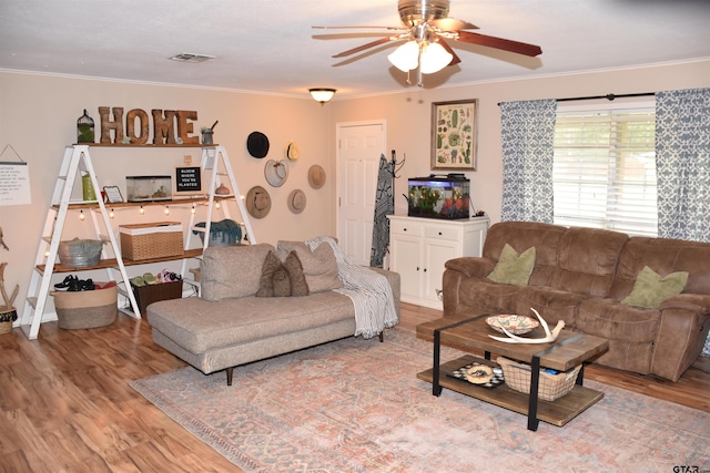607 Brookhollow Dr, Palestine, TX 75801 - living room with wood finished floors, ceiling fan, and crown molding