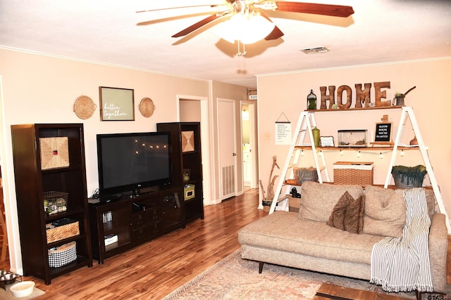 607 Brookhollow Dr, Palestine, TX 75801 - living area with wood finished floors, a ceiling fan, and ornamental molding