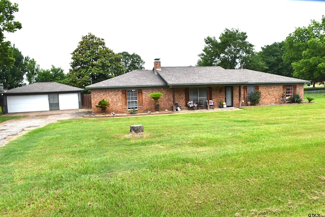 607 Brookhollow Dr, Palestine, TX 75801 - single story home with a garage, a front lawn, a chimney, brick siding, and an outbuilding