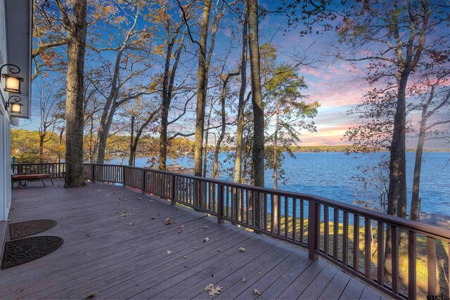 deck at dusk with a water view