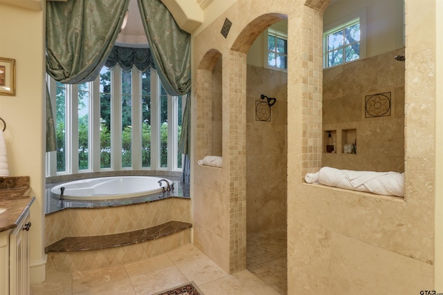 bathroom with vanity, tile patterned floors, and independent shower and bath