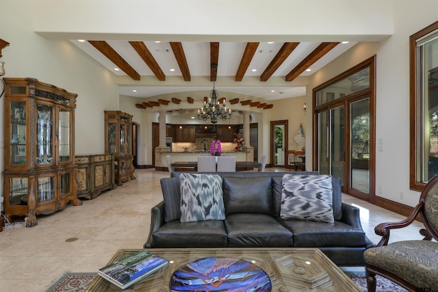 tiled living room with beamed ceiling and a notable chandelier