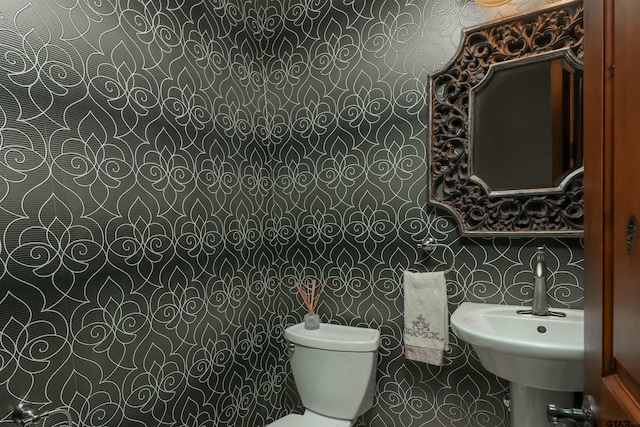 bathroom with sink and toilet