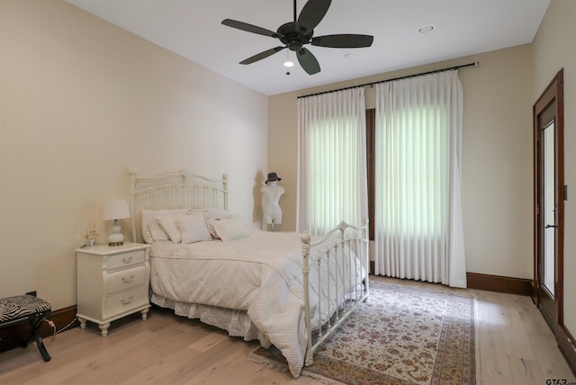 bedroom featuring light hardwood / wood-style floors and ceiling fan