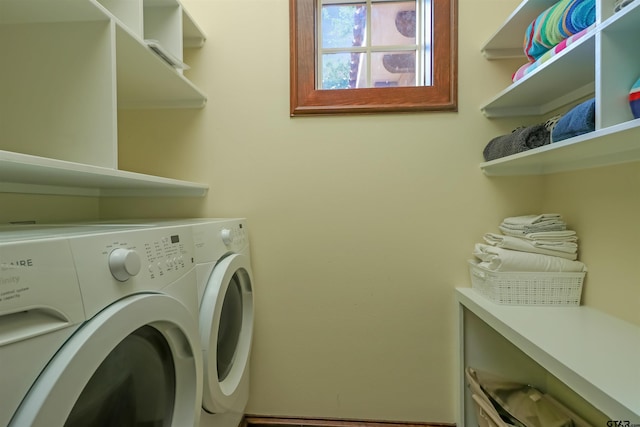 laundry area with washing machine and clothes dryer