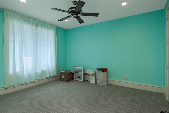 misc room featuring carpet and ceiling fan