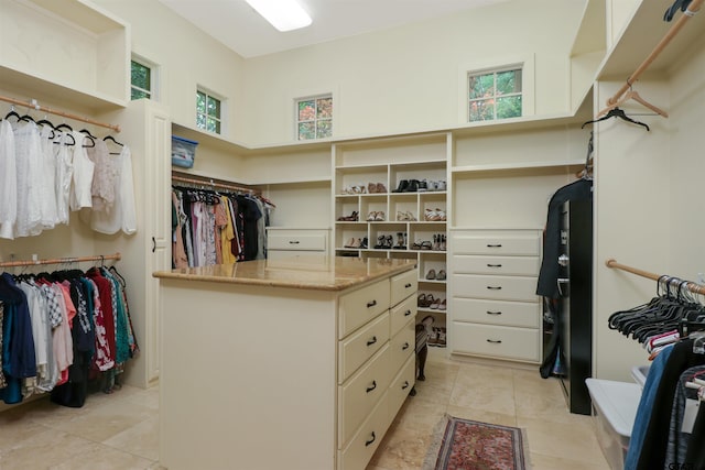 spacious closet featuring light tile patterned floors