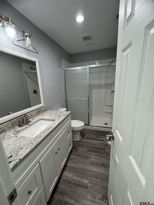10816 Mountain View Pl, Whitehouse, TX 75791 - full bathroom with vanity, a stall shower, and wood finished floors